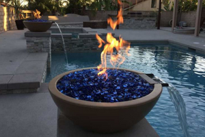 fire and water bowl by the swimming pool