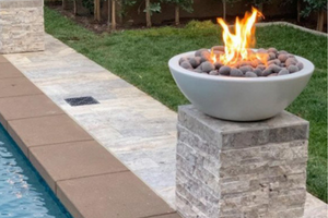 gas fire bowl by the swimming pool