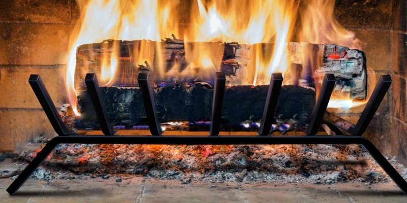 image of a fireplace grate with a log burning