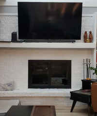 is TV too high above fireplace