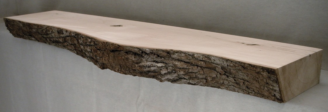 Basswood log mantel with bark face