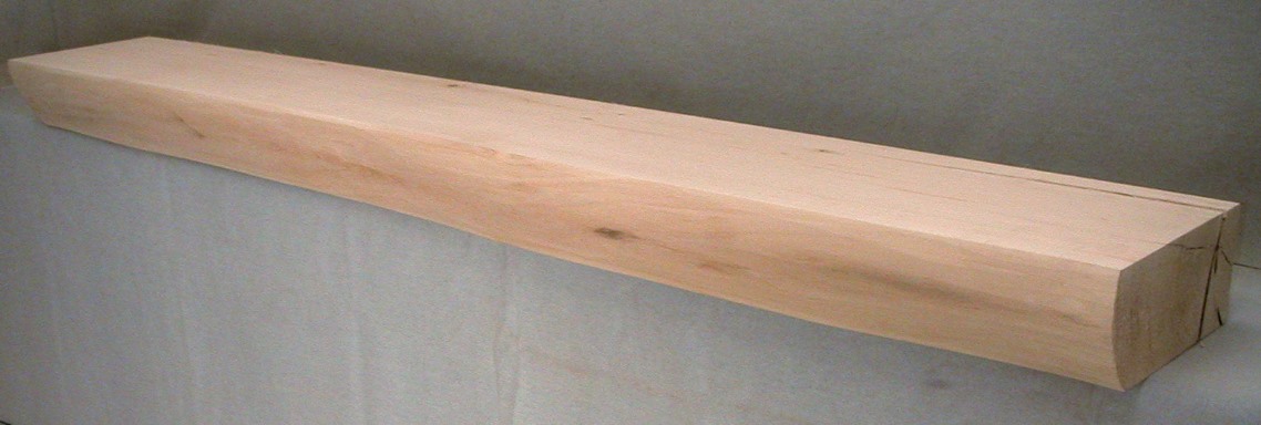 Basswood Log Mantel with a hand planed facing