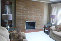 Brushed Nickel Fireview Masonry Fireplace, Tracked BiFold Doors with Smoked Tempered Glass