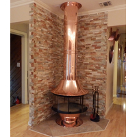 Copper spin a fire wood burning fireplace shown with copper base