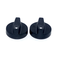 two black knobs with small white arrow on top part as indicator