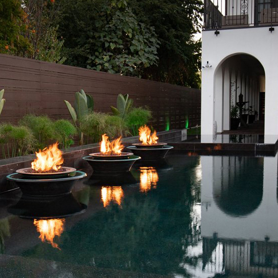 Cazo 360° Spill Copper Fire and Water Bowl by the pool lifestyle
