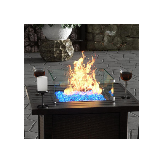 The Outdoor Plus Tempered Wind Guard on top of Fire Pit