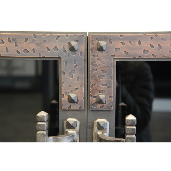 Rivets and banding are highlights of the Ancient zero clearance fireplace door