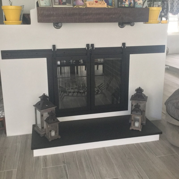 Custom Paterson sliding door for a customer's see through masonry fireplace - opposite side!