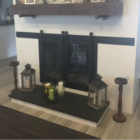 Custom Paterson sliding door for a customer's see through masonry fireplace!