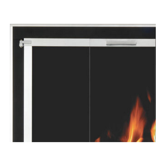 Appalachian masonry door: matte black frame with Satin Brass hinges, handles, and trim around main frame and door frame. Accent Details