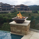 Maya Hammered Copper Fire and Water Bowl in the corner of pool
